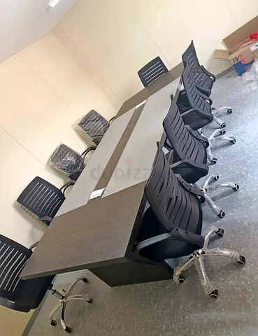Large conference table with 8 ergonomic office chairs - good condition with free delivery 0506768890