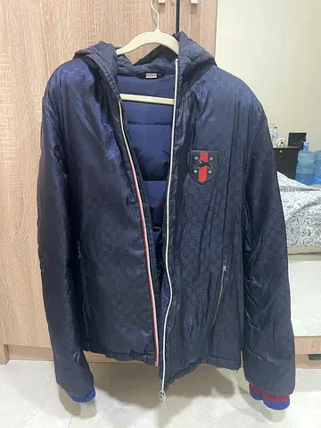 Authentic Gucci navy blue monogram down puffer jacket features an all-over GG jacquard size 52