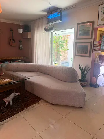 Selling my beautiful designer-inspired curved sofa in cream bouclé fabric.