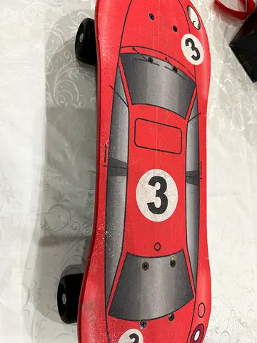 Kids cruiser skateboard with red car graphic - good condition