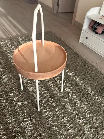 IKEA Wooden Round Side Table with White Metal Frame can be used as handle.