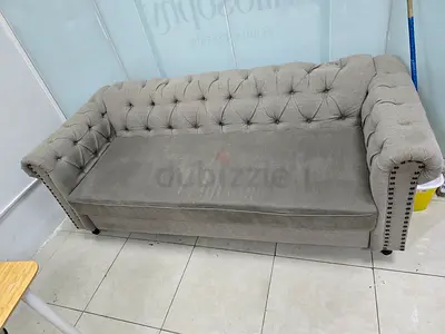 Light grey tufted 3-seater sofa with nailhead trim