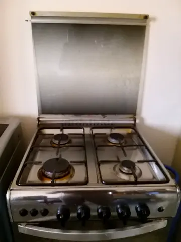 Used 4-Burner Stainless Steel Gas Stove with Oven