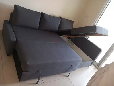 Grey L-shaped Sofa Bed with Storage - Good Condition