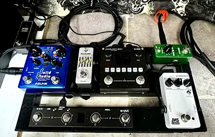 Home-Used guitar effects pedalboard with multi-effects and stomp pedals