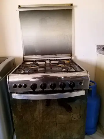 Used 4-Burner Stainless Steel Gas Stove with Oven