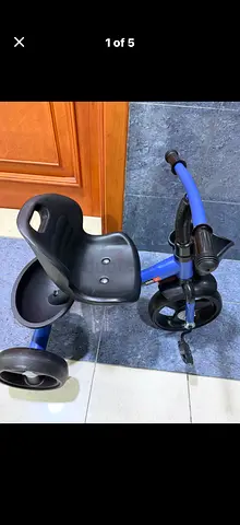 Used toddler tricycle with seat and storage tray -