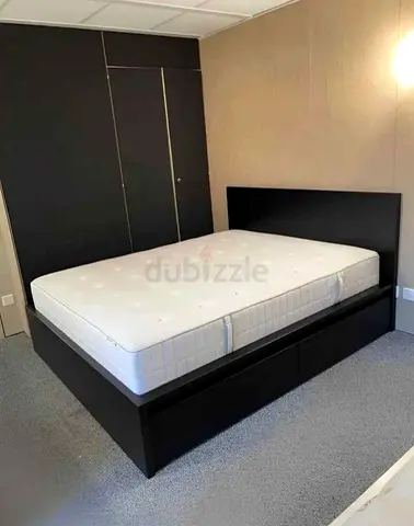 ikea malm king bed with ikea firm mattress   having 2 storage units under the bed