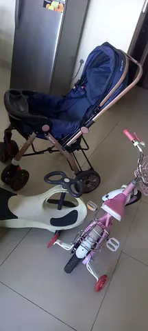 Used baby stroller with toddler tricycle and balance board - good condition