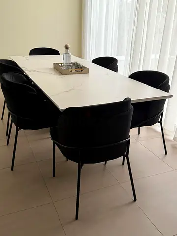 Marble-effect dining table with 6 black upholstered chairs