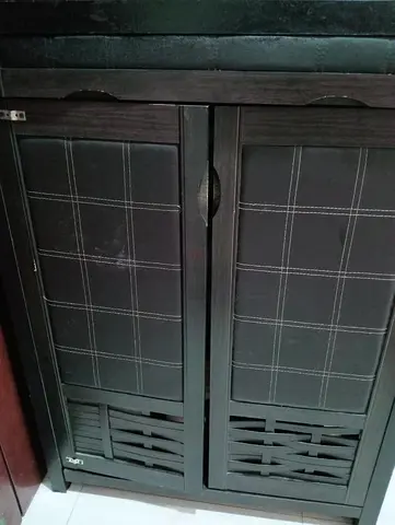 Modern dark brown shoe cabinet with faux leather panels