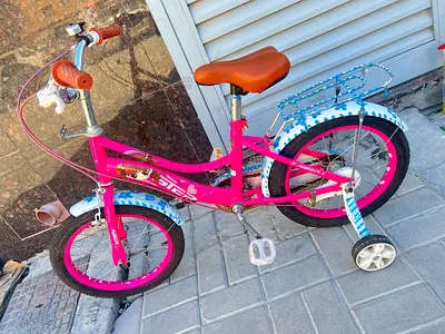 Pink kids 16-inch bicycle with training wheels - good condition