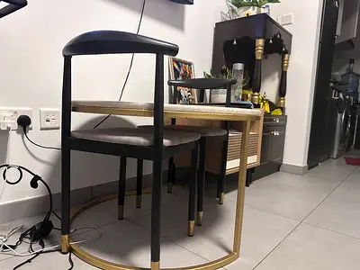 Compact modern dining table with two stools - black and gold