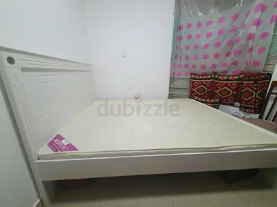 Queen cot with new  medical mattress in good condition