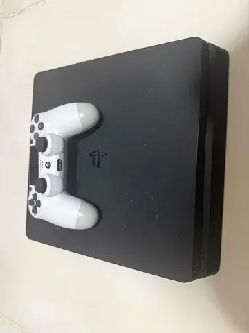 Sony PlayStation 4 Slim with DualShock one Controller - Used