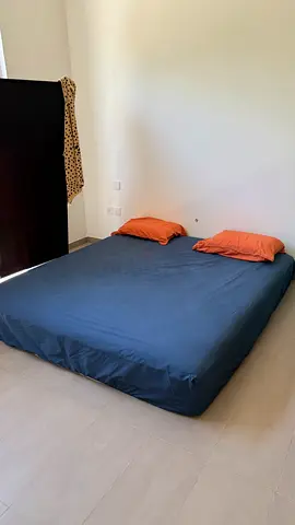 Used queen mattress with fitted cover — excellent condition