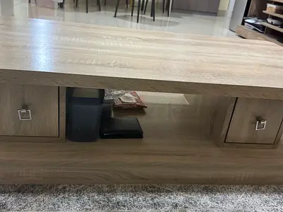Light oak central table unit with storage cabinets