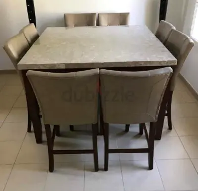 Marble-top dining table with 8 upholstered chairs - good condition