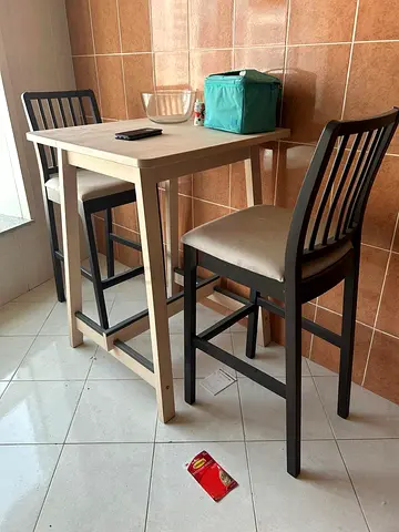 Wooden bar-height table with two matching high chairs - used