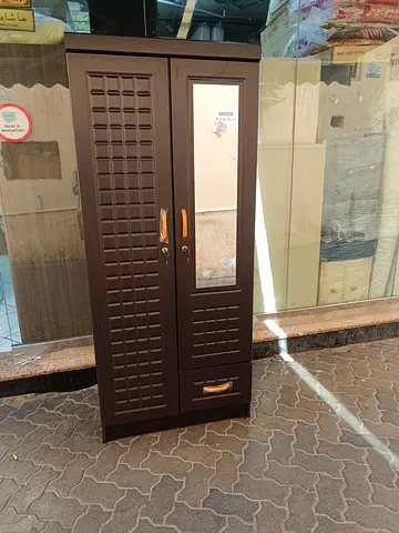 We are selling Double door wood cupboard brand new available
