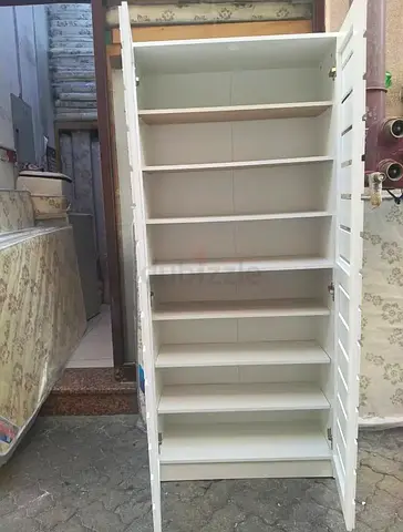 Tall White Wooden Storage Cabinet with Multiple Shelves