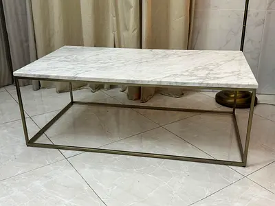 West Elm marble-top coffee table with a gold-finished metal frame