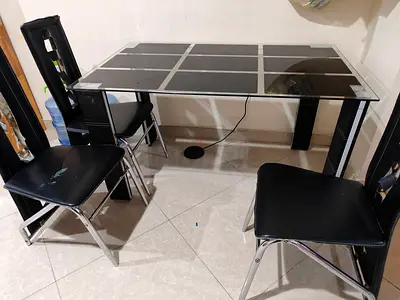 Glass Top Dining Table with 3 Black Chairs