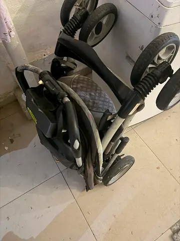Lightly used foldable baby stroller/pram — compact and easy to store
