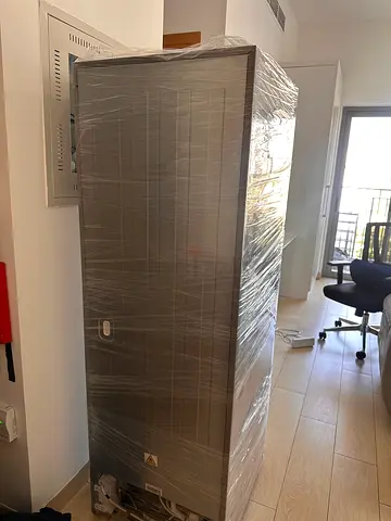 Tall stainless steel Media refrigerator/freezer wrapped and ready almost brand new. 2 door
