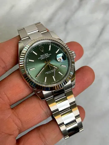 Rolex Datejust-style mens watch with green sunburst dial, stainless steel bracelet