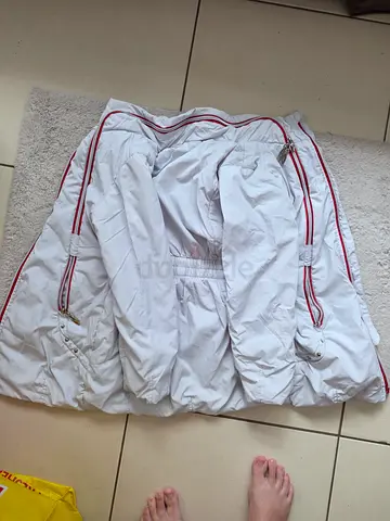 White puffer jacket with red piping, size medium