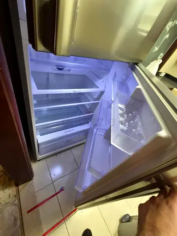 Used top-freezer refrigerator in good working condition