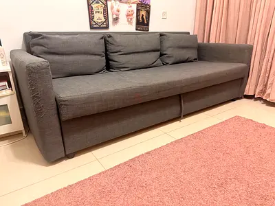 3-seater grey fabric sofa bed with pull-out storage, fair condition