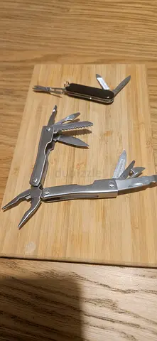 Two multi-tools pocket pliers and small pocket tool with scissors