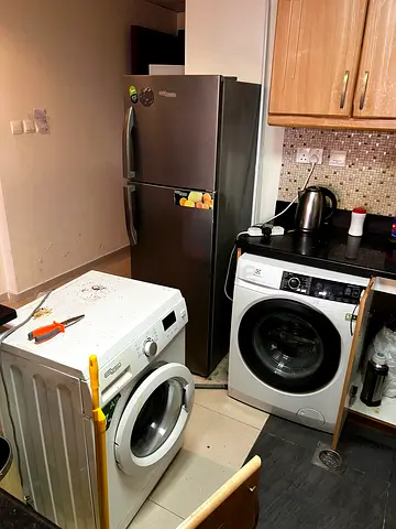 Used front-load washing machine (working) - collection of laundry appliances