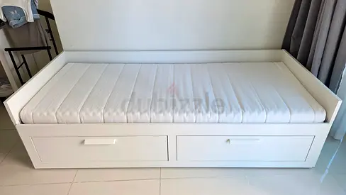 White wooden daybed with storage drawers - single and double size.