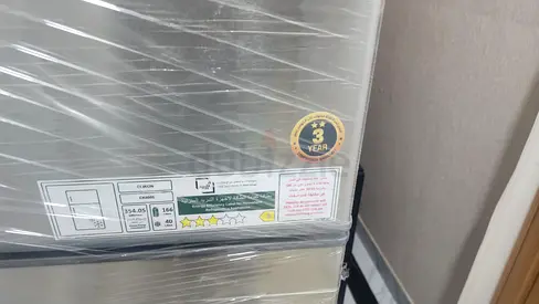 Almost-new single-door refrigerator wrapped in protective film - 3 year warranty sticker-Negotiable
