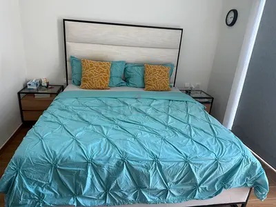 king bed frame with upholstered headboard and bedside tables, mattress