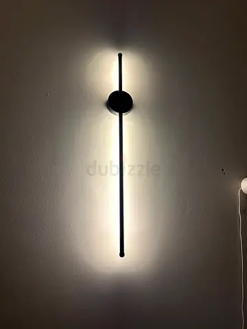 Modern wall-mounted LED linear sconce - slim black finish