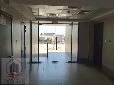 A residential-commercial building for sale in Al Bahyah, with an annual income of 520,000 dirhams, fully rented.