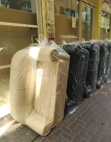 Set of brand-new wrapped rezgin sofas (cream and black) - multiple available