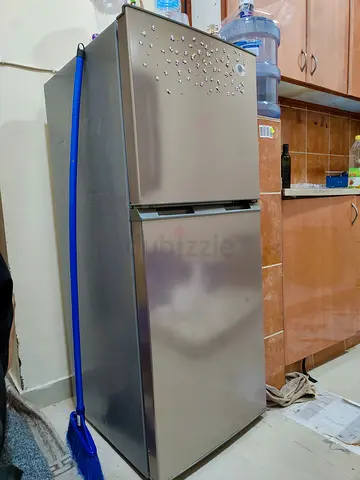 Silver double-door refrigerator in good working condition