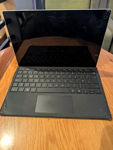 Microsoft Surface Pro with Type Cover (used, screen has corner damage) scrap