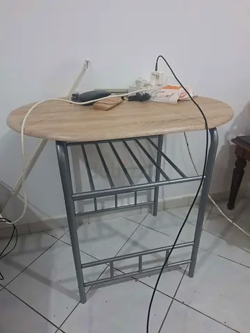 Small oval kitchen island/cart with wooden top and metal frame