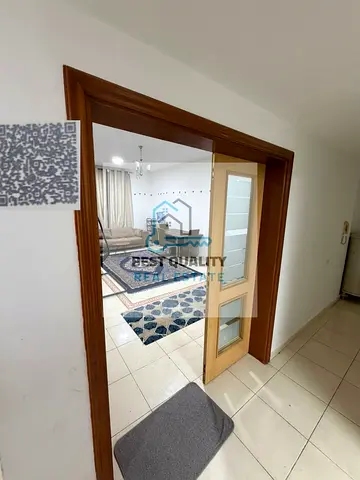 Two furnished rooms and a living room for monthly rent in Al Nuaimiya 3, Khalifa Main Street, opposite Grand Mall