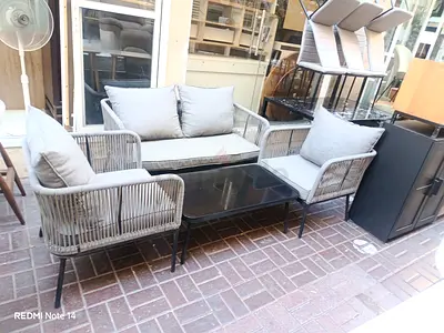 Outdoor/Patio 3-piece rattan-style sofa set with glass coffee table