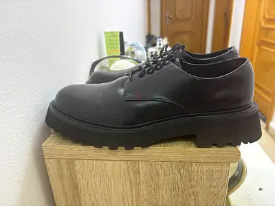 Black leather lace-up shoes
