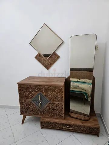 Wooden Bed with 2 side tables and a Dressing Table with Mirror.