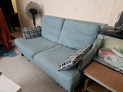 Light blue 2-seater sofa in good used condition