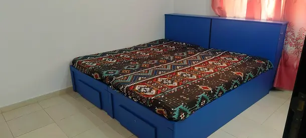 Solid blue wooden double bed with storage drawers - good condition